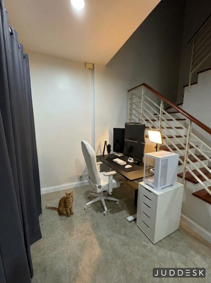 The same room with a full desk setup photorealistically placed in it