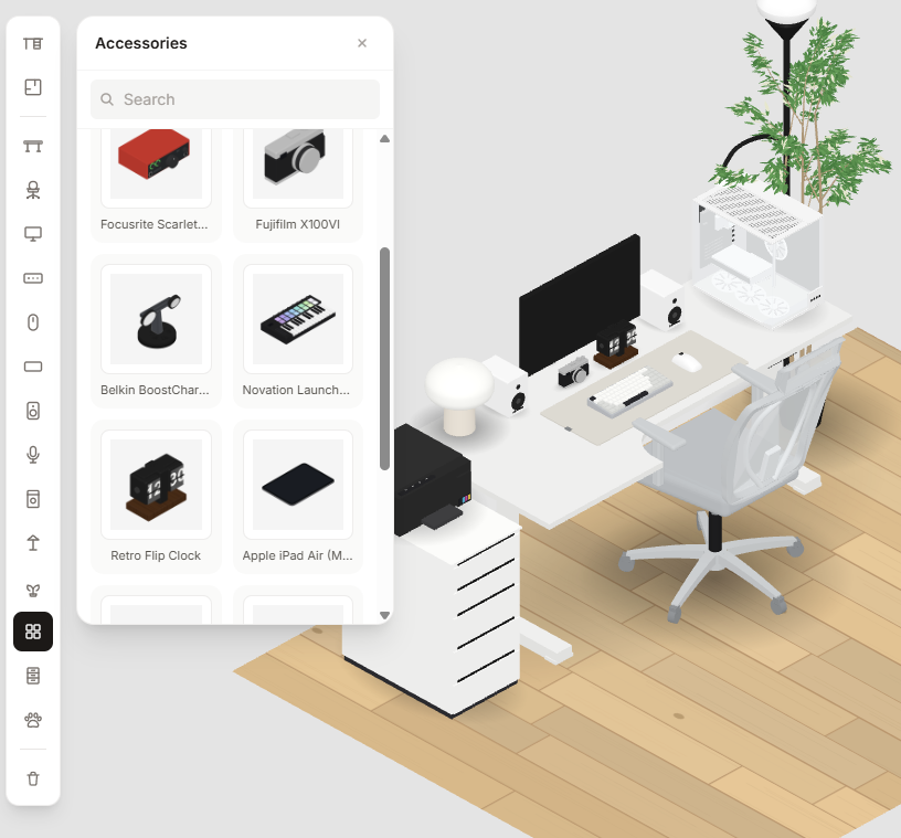 An isometric desk setup being rearranged in Juddesk, showing the playful tile-snapping, building-block feel